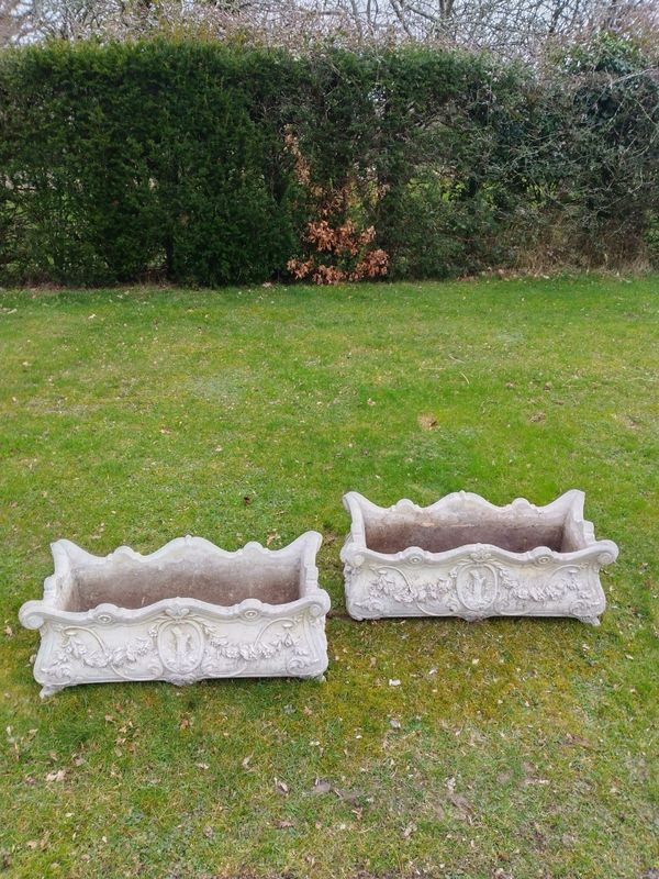 A pair of composition stone planters