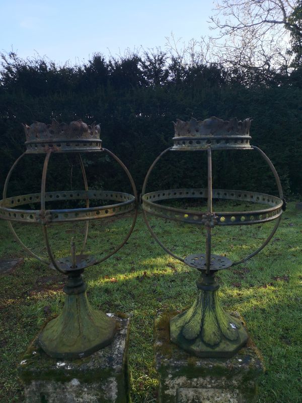 A pair of Victorian cast and wrought iron lanterns