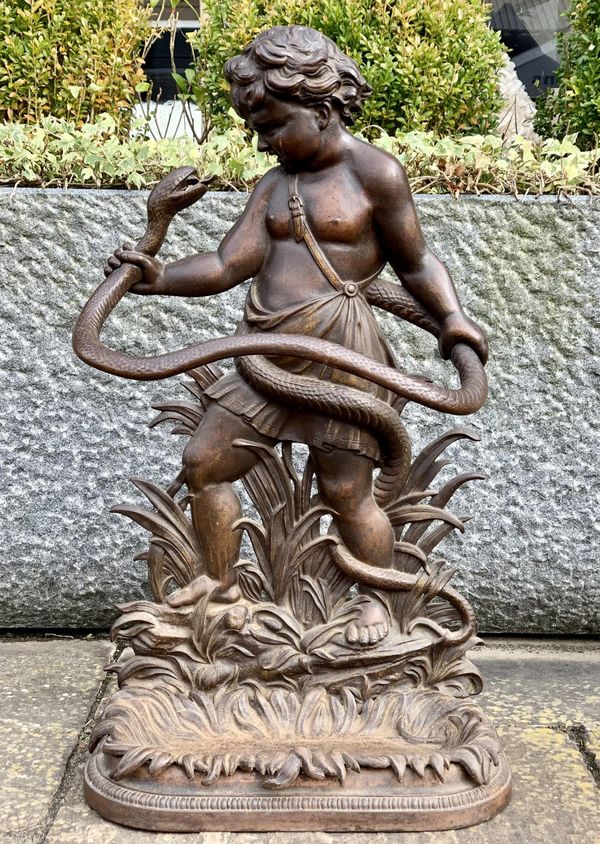 A Coalbrookdale stick stand of Hercules wrestling a snake