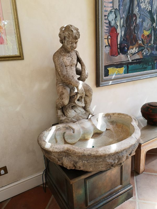 A carved white marble fountain