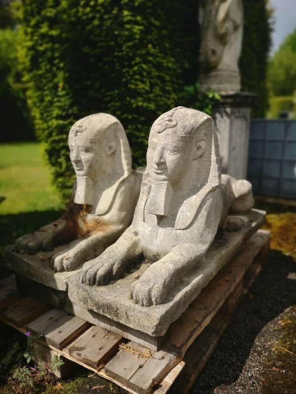 A pair of  composition stone  sphinxes