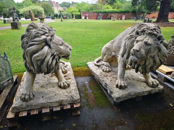 A pair of composition stone lions
