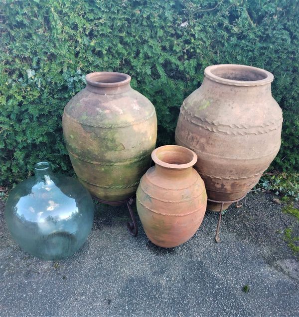 Three terracotta oil storage jars