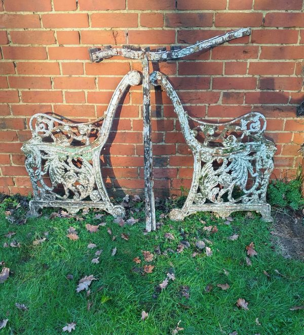 A pair of unusual Victorian cast iron seat ends and frame