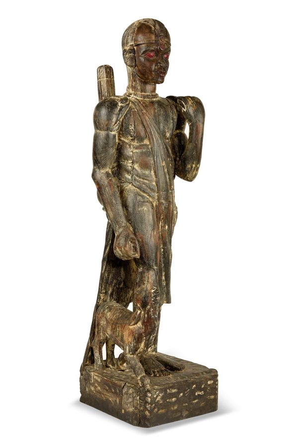 A carved hardwood  figure of a Zulu man with his dog
