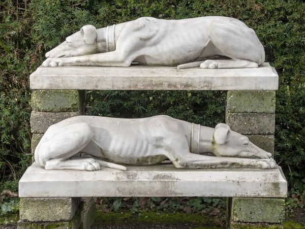 A  pair of  carved white marble greyhounds in the style of Joseph Gott