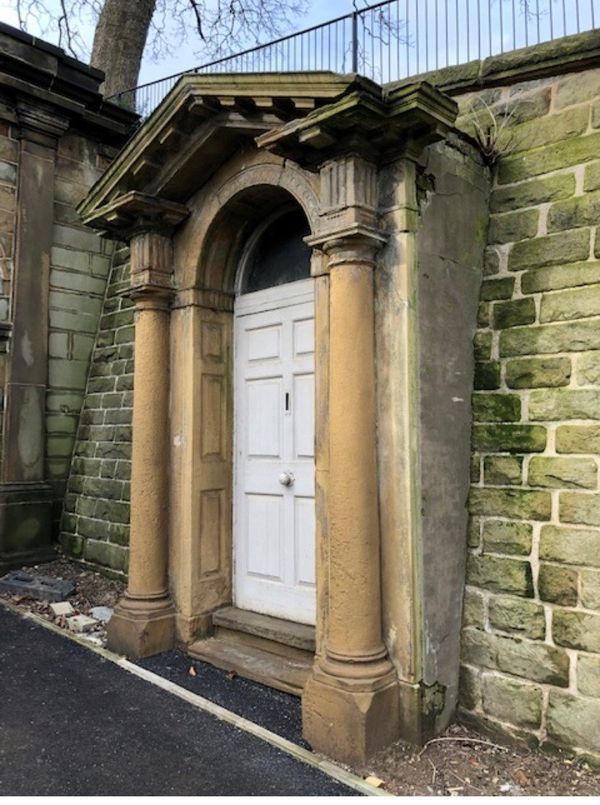 An historic Georgian carved sandstone door surround and painted pine door
