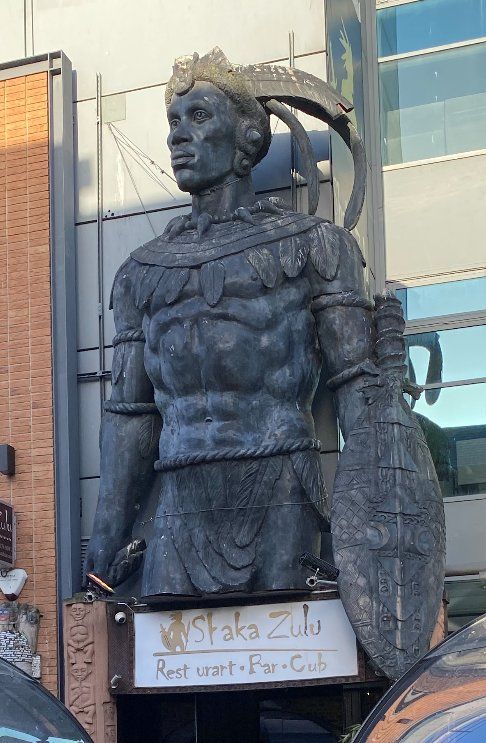 A massive patinated fibreglass figure of King Shaka of the Zulus