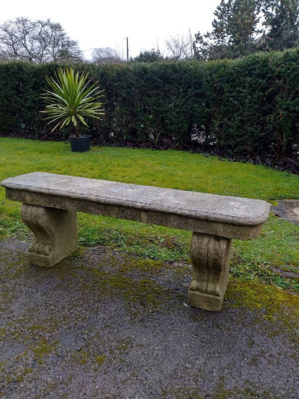 A carved limestone bench