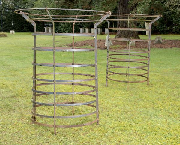 A pair of steel tree guards
