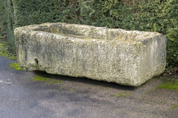A large carved limestone trough