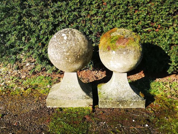 A pair of composition stone gate pier balls 2nd half 20th century 57cm high