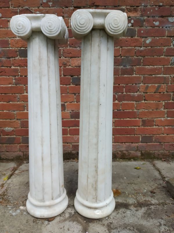 A pair of carved  white marble pedestals