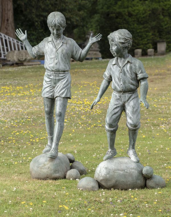 Two bronzes of children on stepping stones