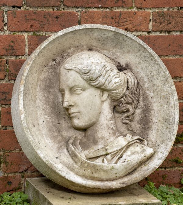 A white marble carved portrait roundel