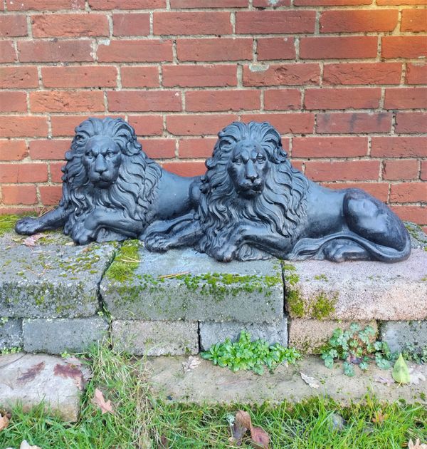 Two cast iron lion doorstops