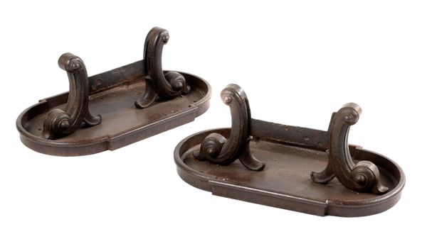 A pair of substantial & unusual cast iron boots scrapers