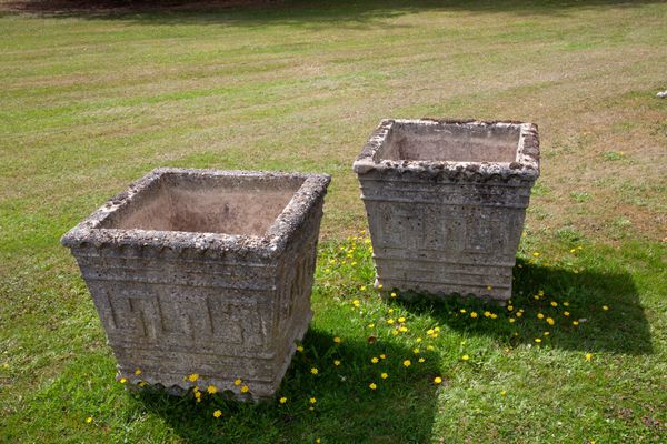 A pair of composition stone square planters