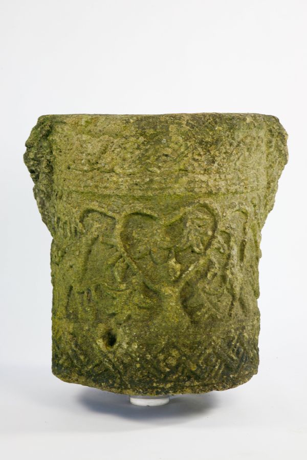 A rare Romanesque style carved granite wellhead