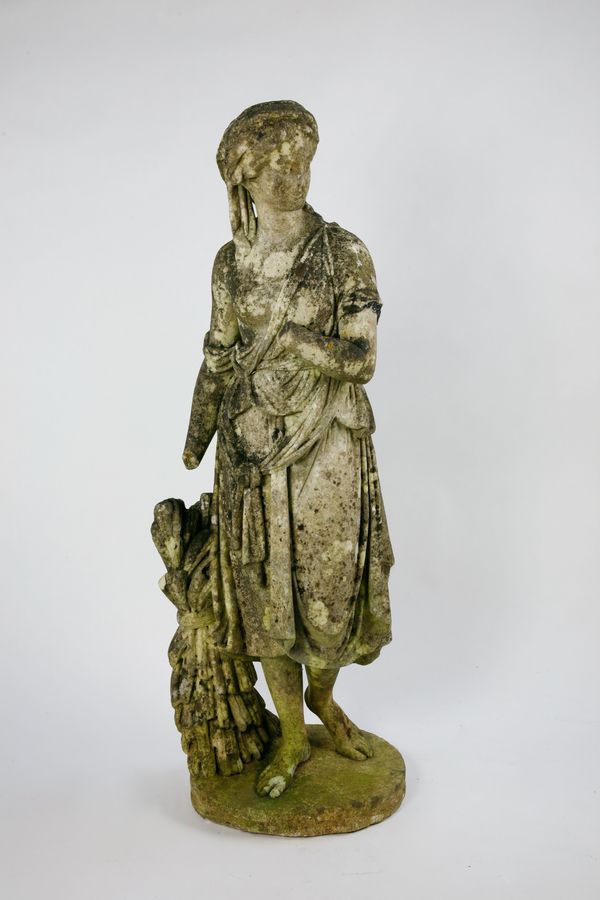 A carved white marble figure of a maiden