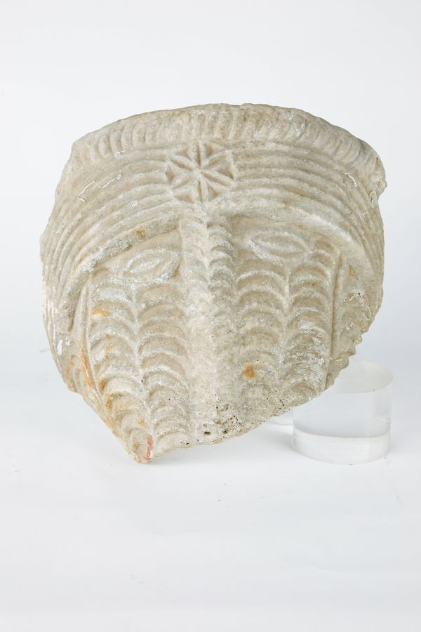 An unusual carved marble fragment