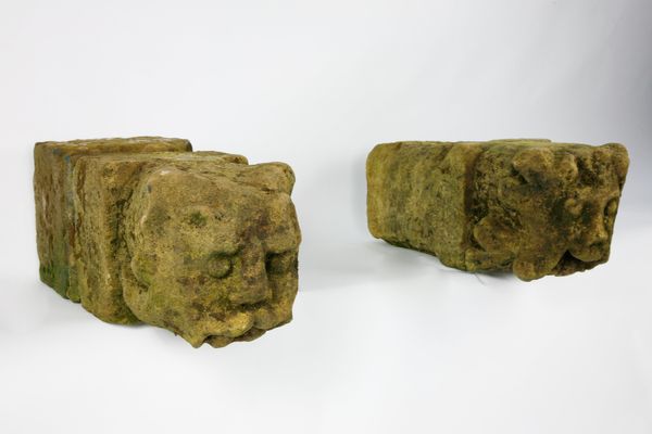 A pair of carved stone gargoyles