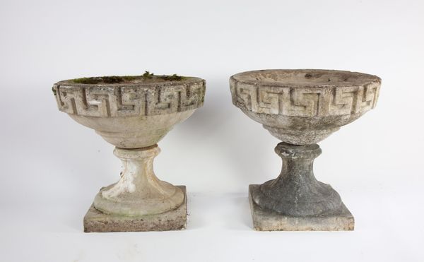 A pair of composition stone shallow bird baths