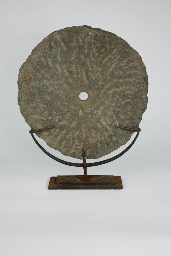 A basalt currency disk