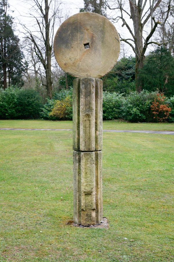 A Barbara Hepworth style stone sculpture