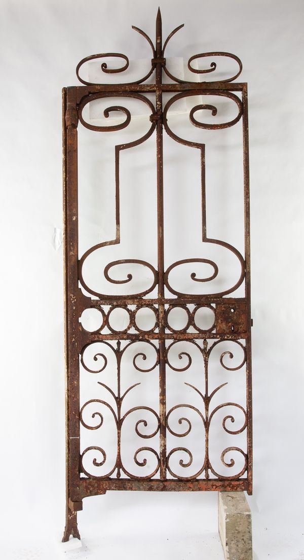A heavy wrought iron gate