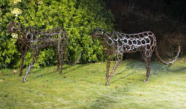 An iron cheetah constructed from simulated horseshoes modern 230cm long by 104cm high