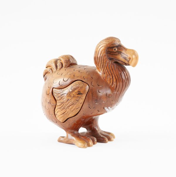 Wooden sculpture with concealed drawer