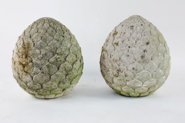 †A pair of carved limestone artichoke finials