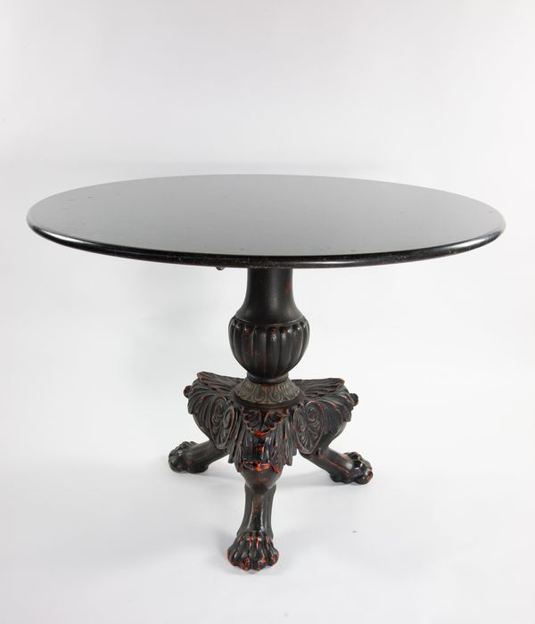 A cast iron circular table with Belgium fossil marble top