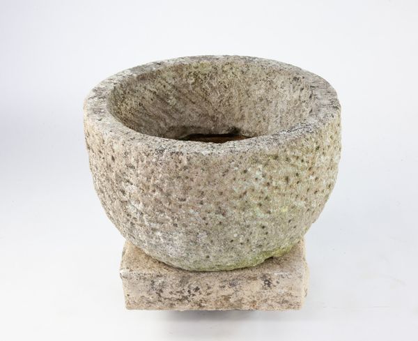 A carved stone planter