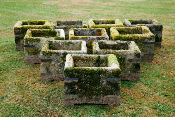 † A group of 10 sandstone Loxwood planters