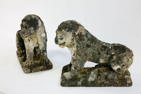 A pair of 18th century style carved stone lions